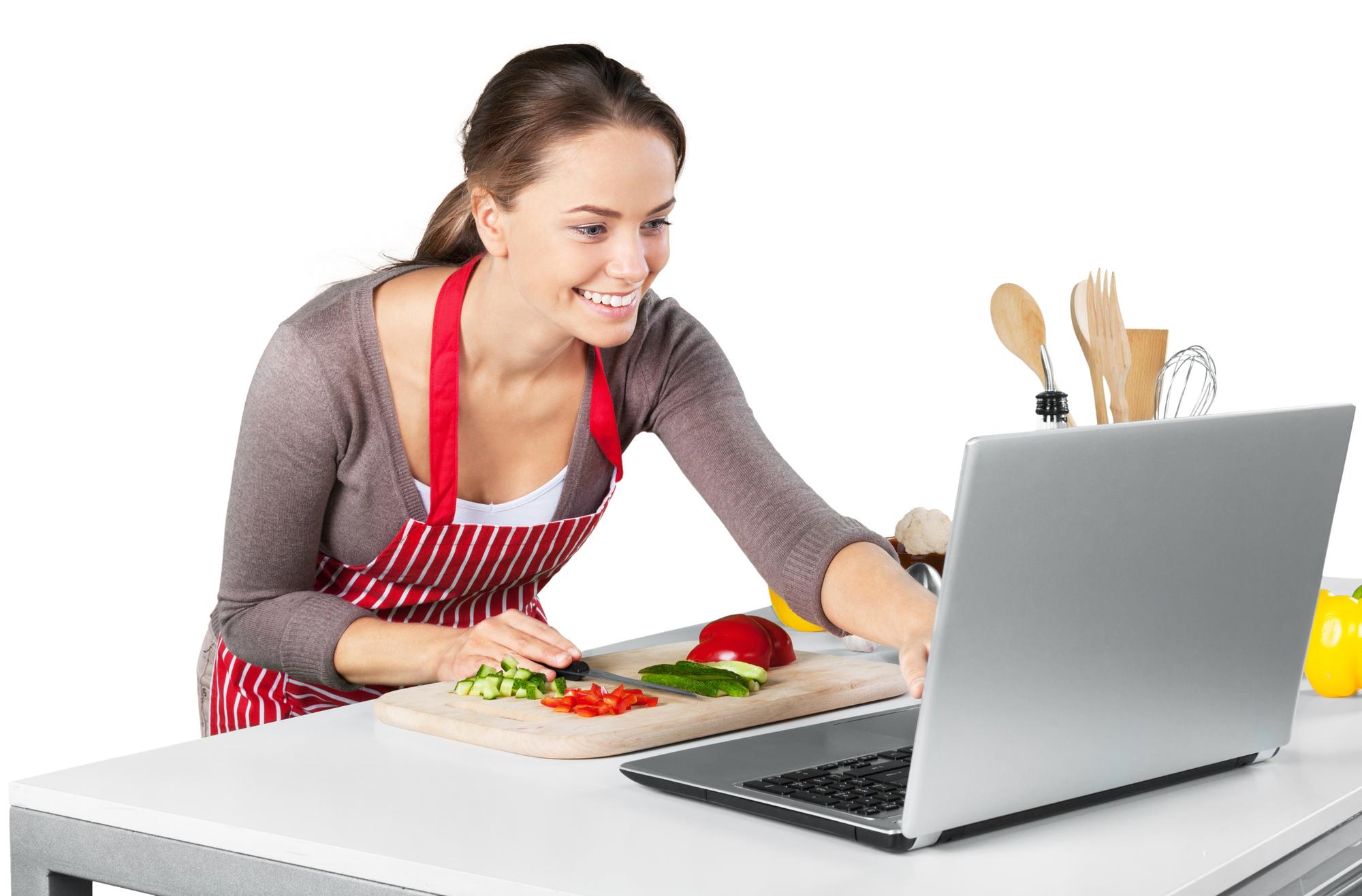 Student cooking with instructor on screen