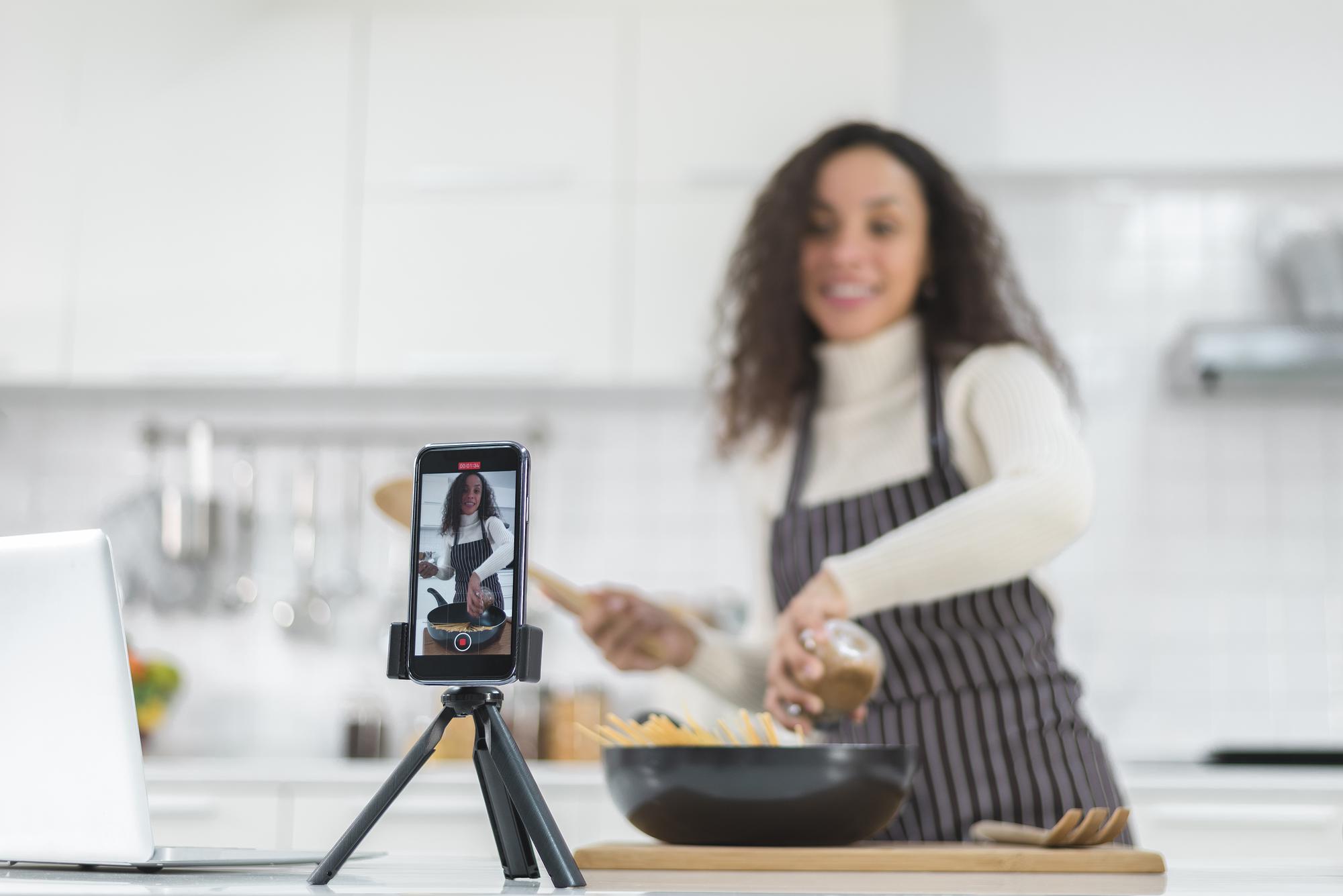 Chef teaching online in a warm kitchen